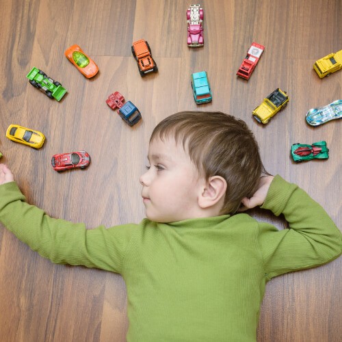 Child playing with toys on vinyl flooring | Custom Floors