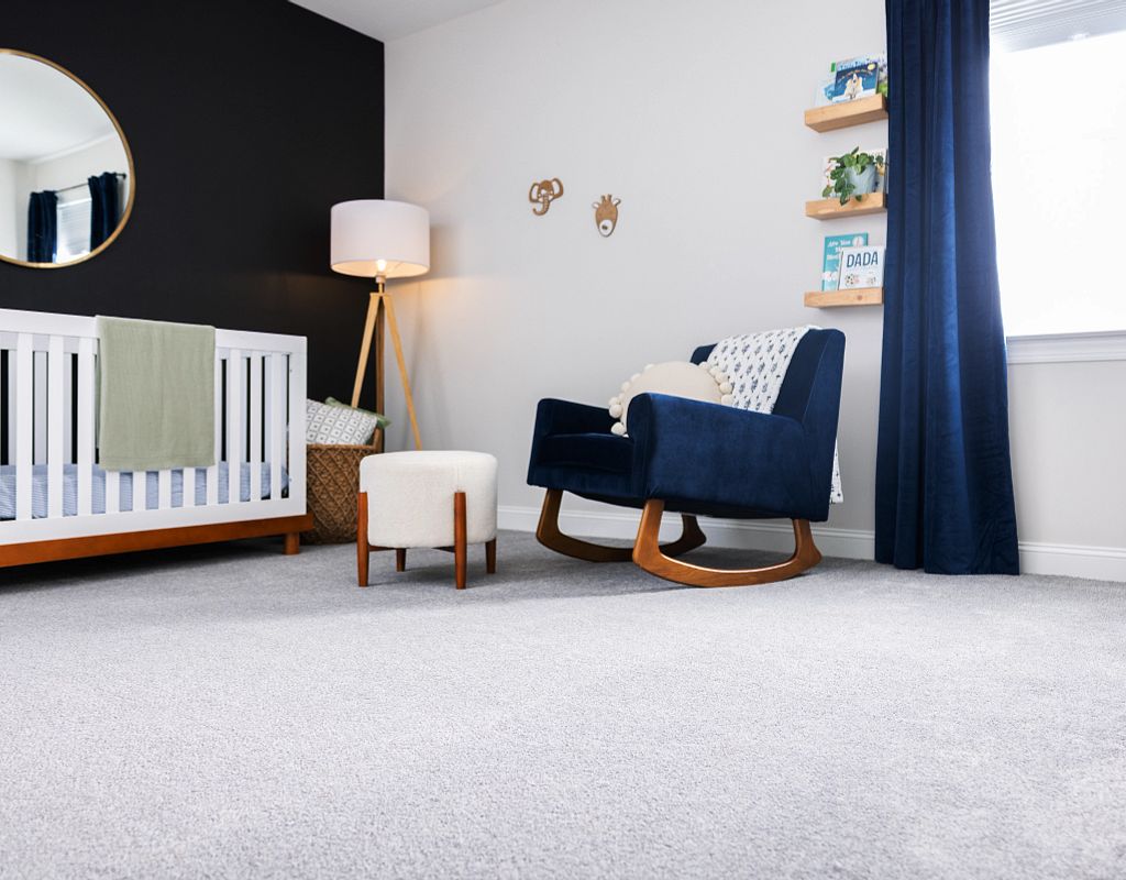 Carpet flooring with blue couch | Custom Floors